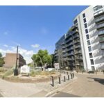 Child dies after falling from block of flats in south London